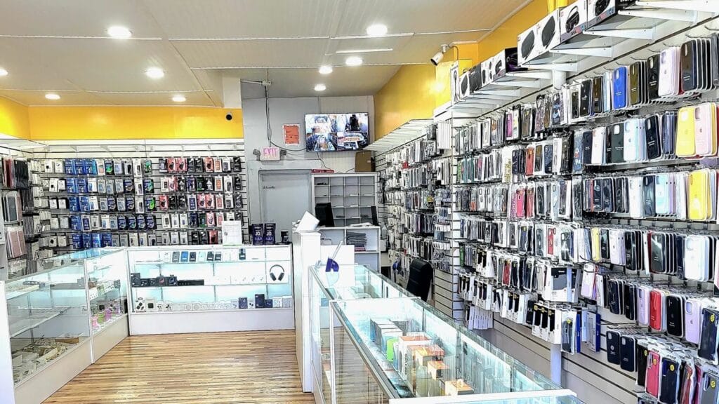 Inside MT Phone Fix: walls of phone cases, chargers and accessories, with glass display counters